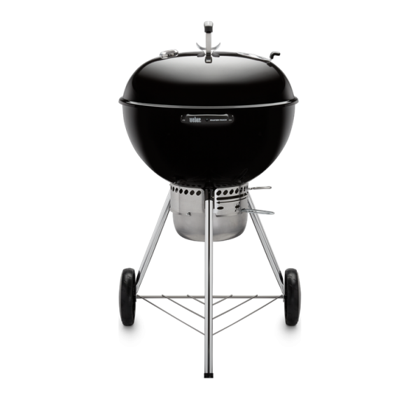 A Weber Master-Touch 22 Charcoal Grill on a black background.