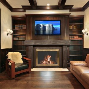 A living room with a Stoll Triple Panel Screen over the fireplace.