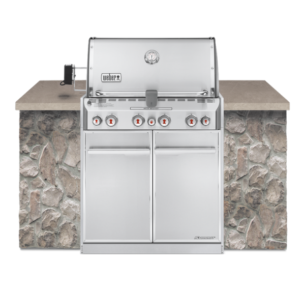 A Weber Summit S-460 Built-In with a stone counter top.