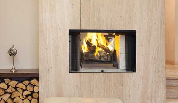 An Astria Craftsman See-Thru Wood Burning Fireplace in a living room.