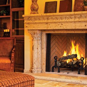 An Astria Georgian Wood Burning Fireplace in a living room.