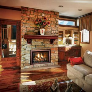 An Empire Innsbrook Direct Vent Gas Insert fireplace in a living room.