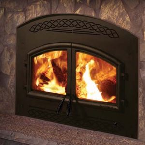 A Heatilator Constitution Wood Burning Fireplace in a stone fireplace.