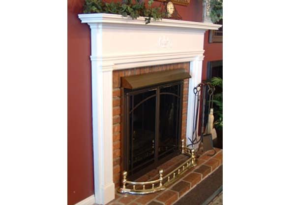 A Stoll Fireplace Hood with a mantle and a mantle.