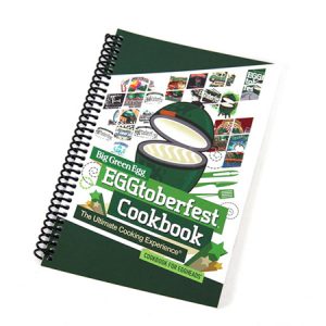 A spiral notebook with the title of the Big Green Egg EGGtoberfest Cookbook.