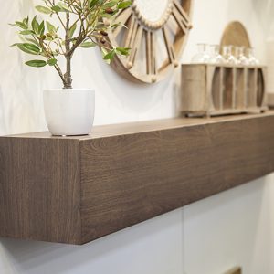 A wooden shelf with Decorative Banding on Stoll Shelves.