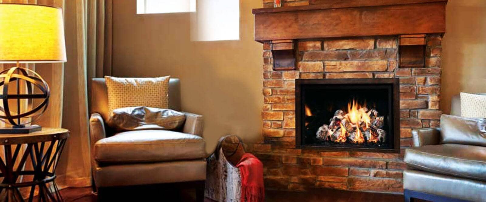 A living room with a fireplace and chairs.