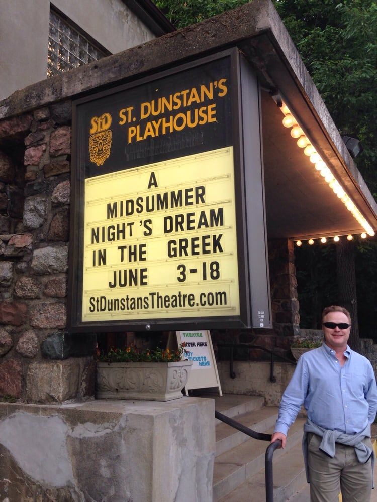 A man standing in front of a sign that says st dunstan's midsummer's dream.